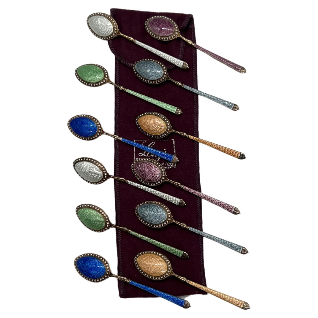 Set of 12 Thomae Sterling Silver Enamel Demitasse Spoons: Set of 12 Thomae Sterling Silver Enamel Demitasse Spoons This exquisite set of 12 demitasse spoons, crafted by the Thomae Company, showcases a captivating blend of sterling silver and vibrant enamel. 