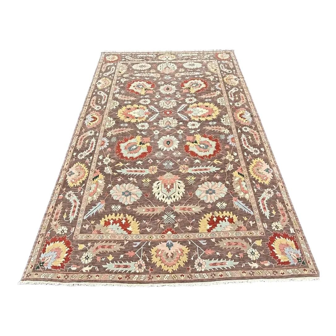 Hand Woven Wool Geometric Rug Approx 12x18 Brown: Hand Woven Wool Geometric Rug Approx 12x18 Brown This hand-woven geometric pattern rug features a mocha-colored field with earth tone accents, crafted from 100% wool pile. Approximately 30 years old, 