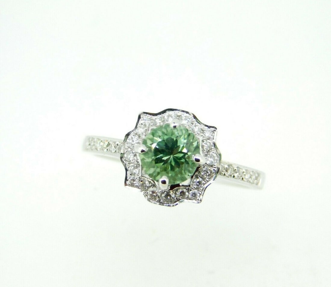 18k White Gold Halo Ring Sea Green Tourmaline Diamond 1.13ct GIA Certified: 18k White Gold Halo Ring Sea Green Tourmaline Diamond 1.13ct GIA Certified This exquisite ring features an 18k white gold setting adorned with a stunning sea green genuine natural tourmaline at its ce