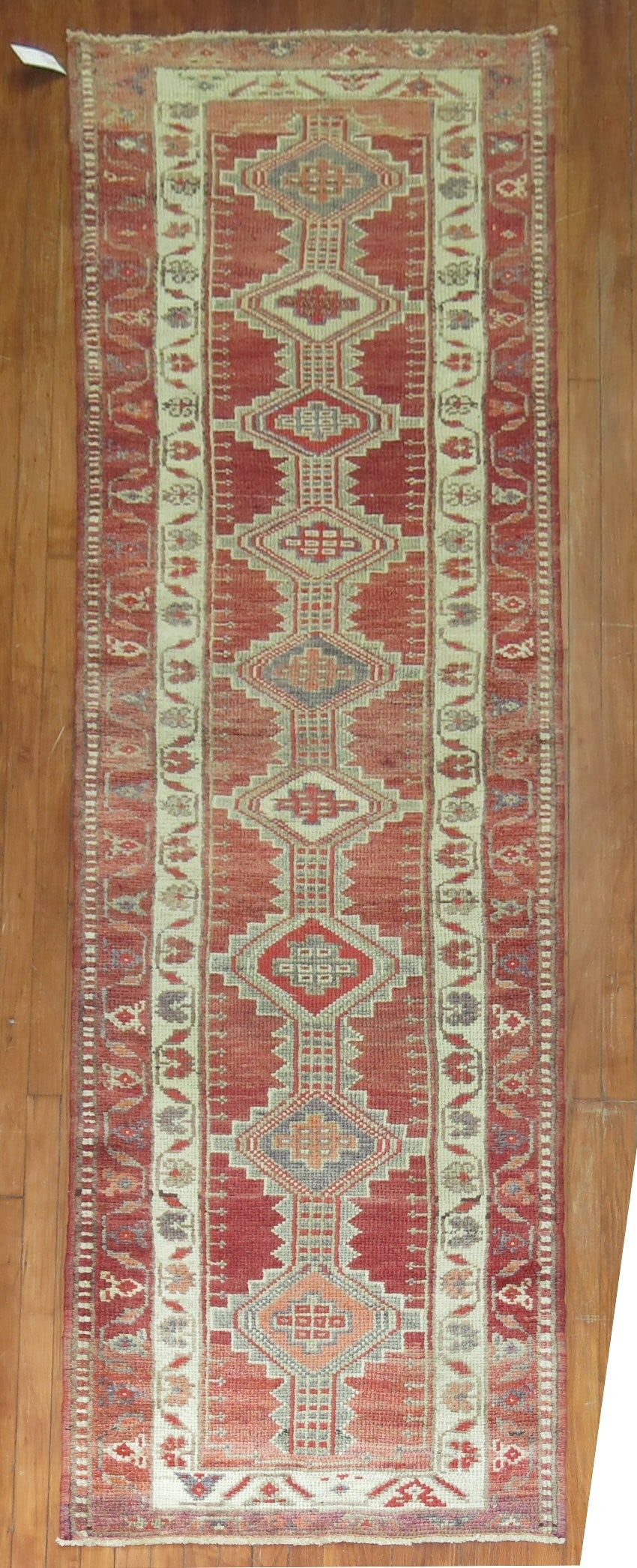 2' 10" x 11' 7" Mid 20th Century Anatolian Turkish Runner: 2' 10" x 11' 7" Mid 20th Century Anatolian Turkish Runner Mid-20th century Turkish Anatolian runner with geometric patterning. This pre-owned woven rug is presented in a classic runner format. Specifi