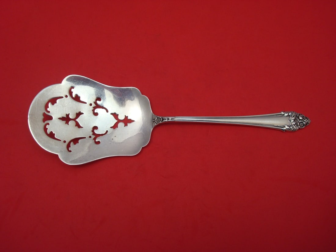 Reed & Barton Fragrance Sterling Silver Pierced Tomato Server 7 3/4": Reed & Barton Fragrance Sterling Silver Pierced Tomato Server 7 3/4" This exquisite tomato server is crafted from high-quality sterling silver and features a beautiful pierced design, measuring 7 3/4"
