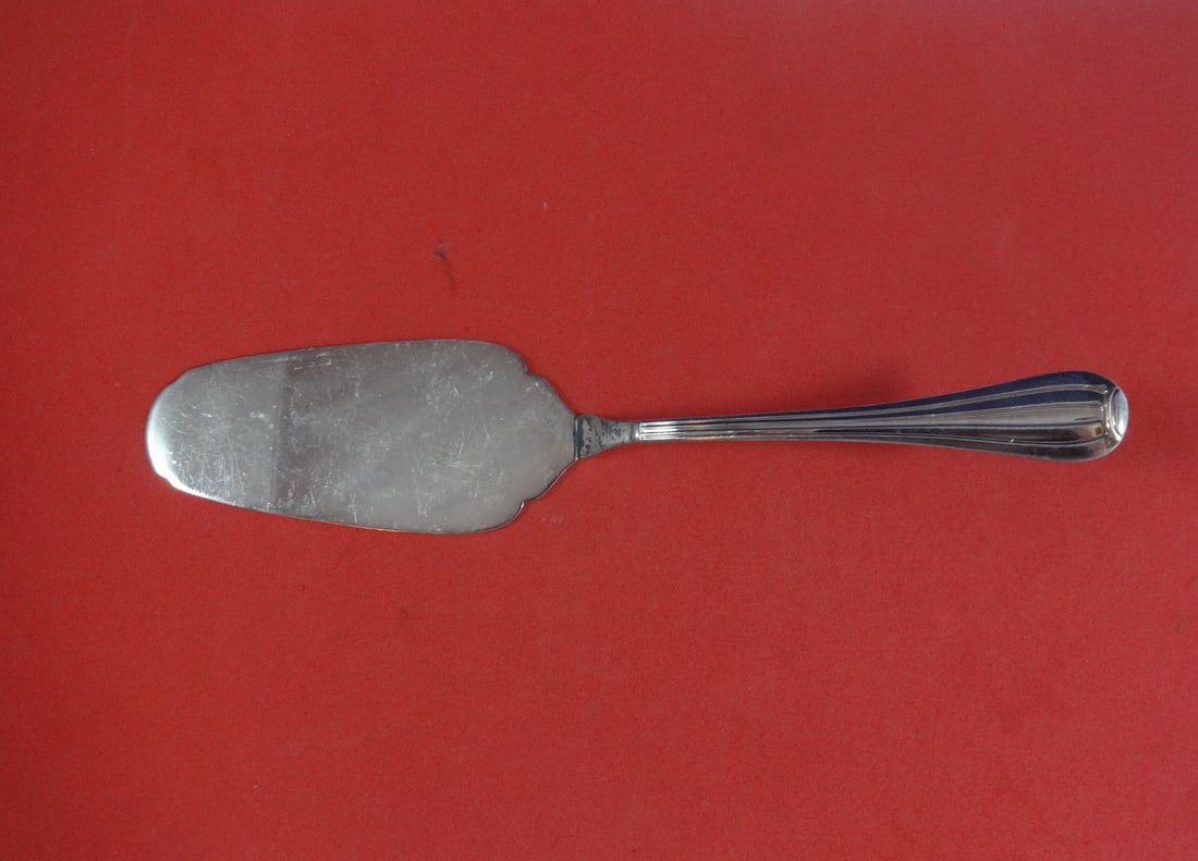 Ricci Meridiani Sterling Silver Pie Server 10 3/4" Unused: Ricci Meridiani Sterling Silver Pie Server 10 3/4" Unused This elegant pie server, crafted by Ricci, features a beautiful sterling silver composition. The server is part of the Meridiani pattern and s