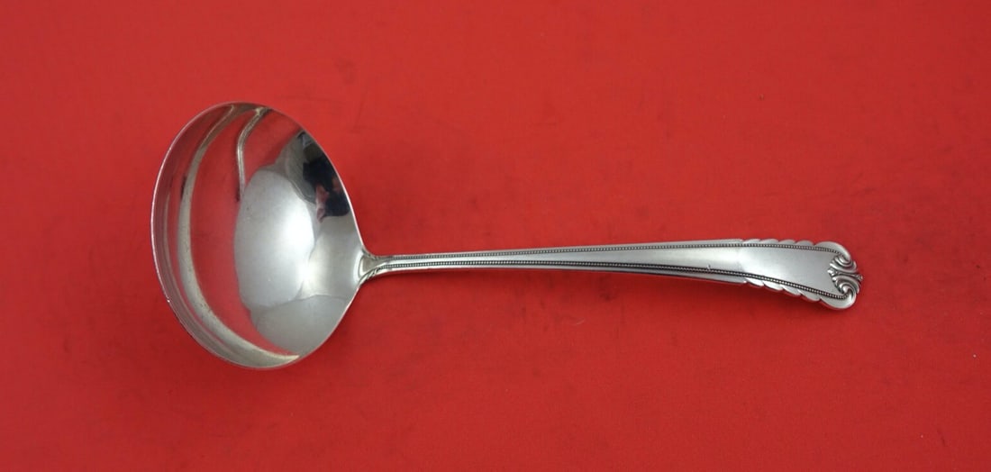 International Sterling Silver Gravy Ladle Moonbeam 6 3/8": International Sterling Silver Gravy Ladle Moonbeam 6 3/8" This exquisite gravy ladle from the Moonbeam pattern by International Sterling is a stunning addition to any table setting. Crafted from
