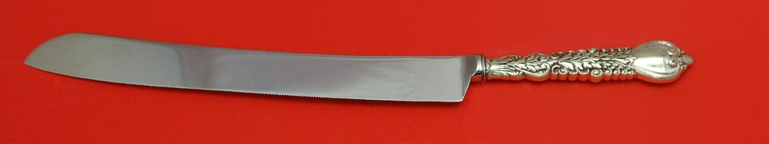Tiffany & Co. Florentine Sterling Silver Wedding Cake Knife 12": Tiffany & Co. Florentine Sterling Silver Wedding Cake Knife 12" This exquisite wedding cake knife from Tiffany & Co. features a classic Florentine pattern. Crafted from high-quality sterling silver, t