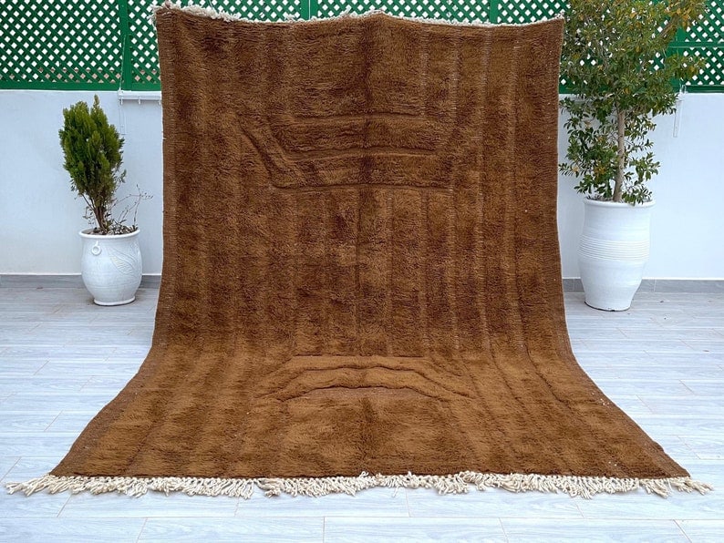 Authentic Moroccan Berber Wool Rug 9.84x6.56 Feet Handmade: Authentic Moroccan Berber Wool Rug 9.84x6.56 Feet Handmade Discover the beauty of this authentic soft brown handmade Moroccan Berber wool rug, featuring an intricately engraved geometric pattern. Craf