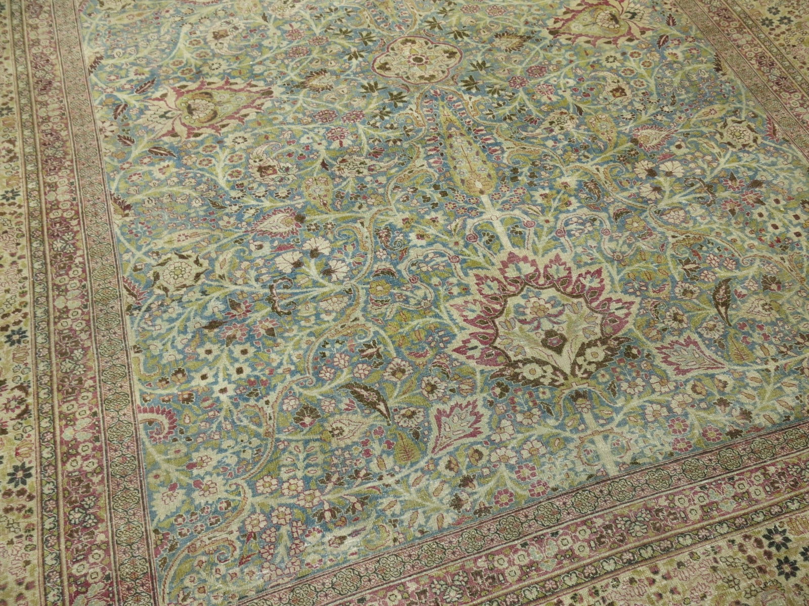 10' 6" x 13' 2" Persian Meshed Room Rug 1920s: 10' 6" x 13' 2" Persian Meshed Room Rug 1920s Formal Persian Meshed rug from the 1920s featuring a detailed traditional pattern in raspberry, green, and blue tones. A pre-owned room-size rug with clas