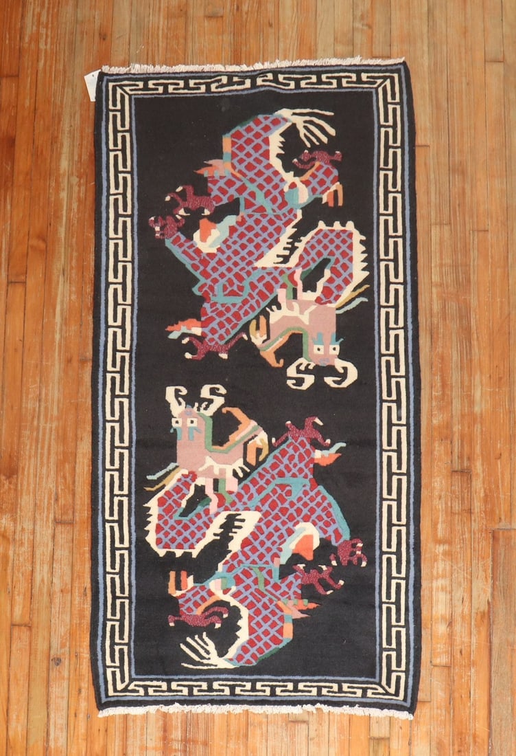 3' 2" x 6' 1" Pictorial Tibetan Rug with Dragon Motif: 3' 2" x 6' 1" Pictorial Tibetan Rug with Dragon Motif Late 20th century Tibetan pictorial rug featuring a dragon motif and a geometric border. This pre-owned small rug presents a colorful decorative d