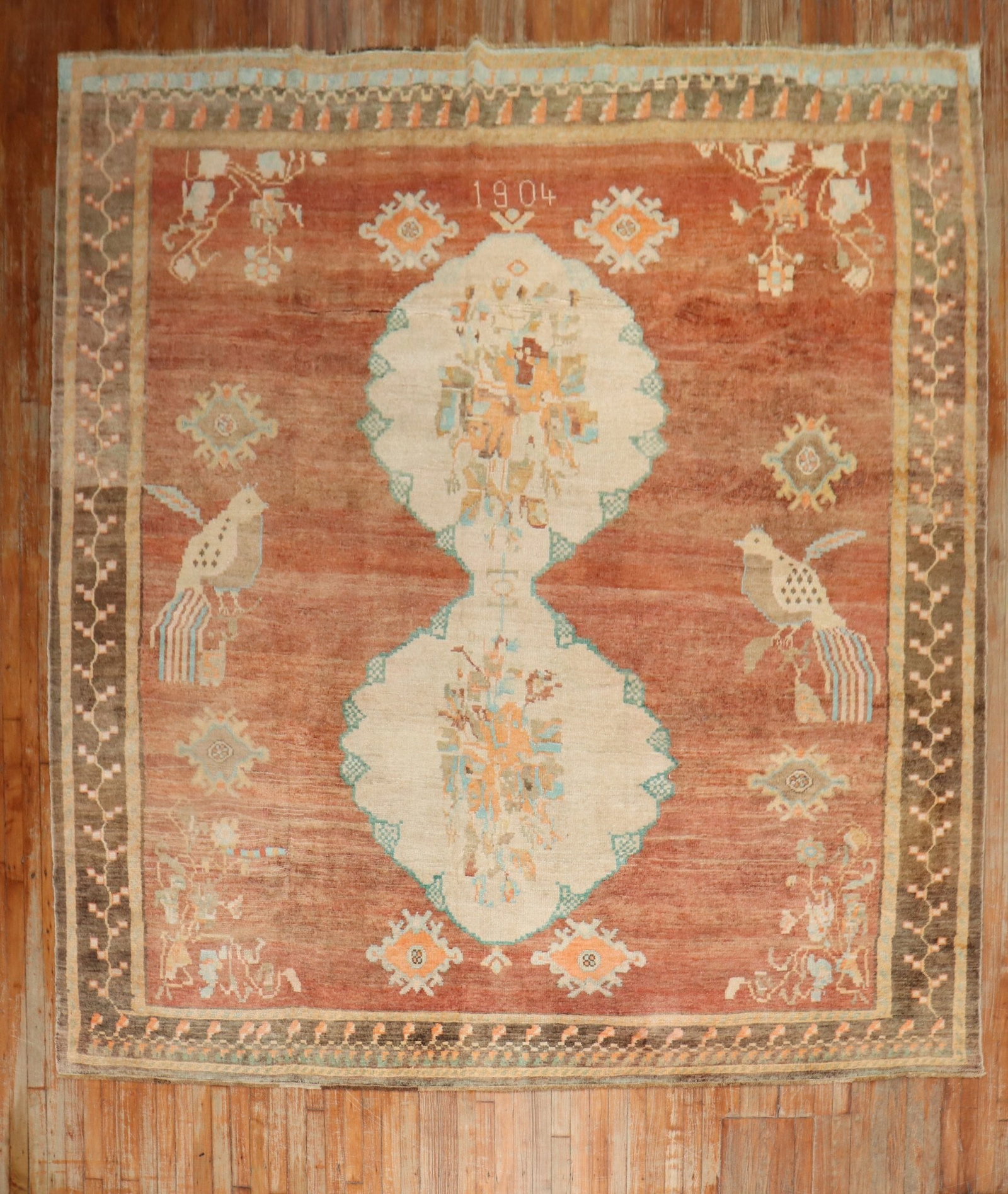 9' 5" x 11' 5" Turkish Kars pictorial rug with 2 pigeons dated 1904: 9' 5" x 11' 5" Turkish Kars pictorial rug with 2 pigeons dated 1904 Early 20th century Turkish Kars pictorial room rug with a dated 1904 design, featuring two large pigeons on an apricot field. This p