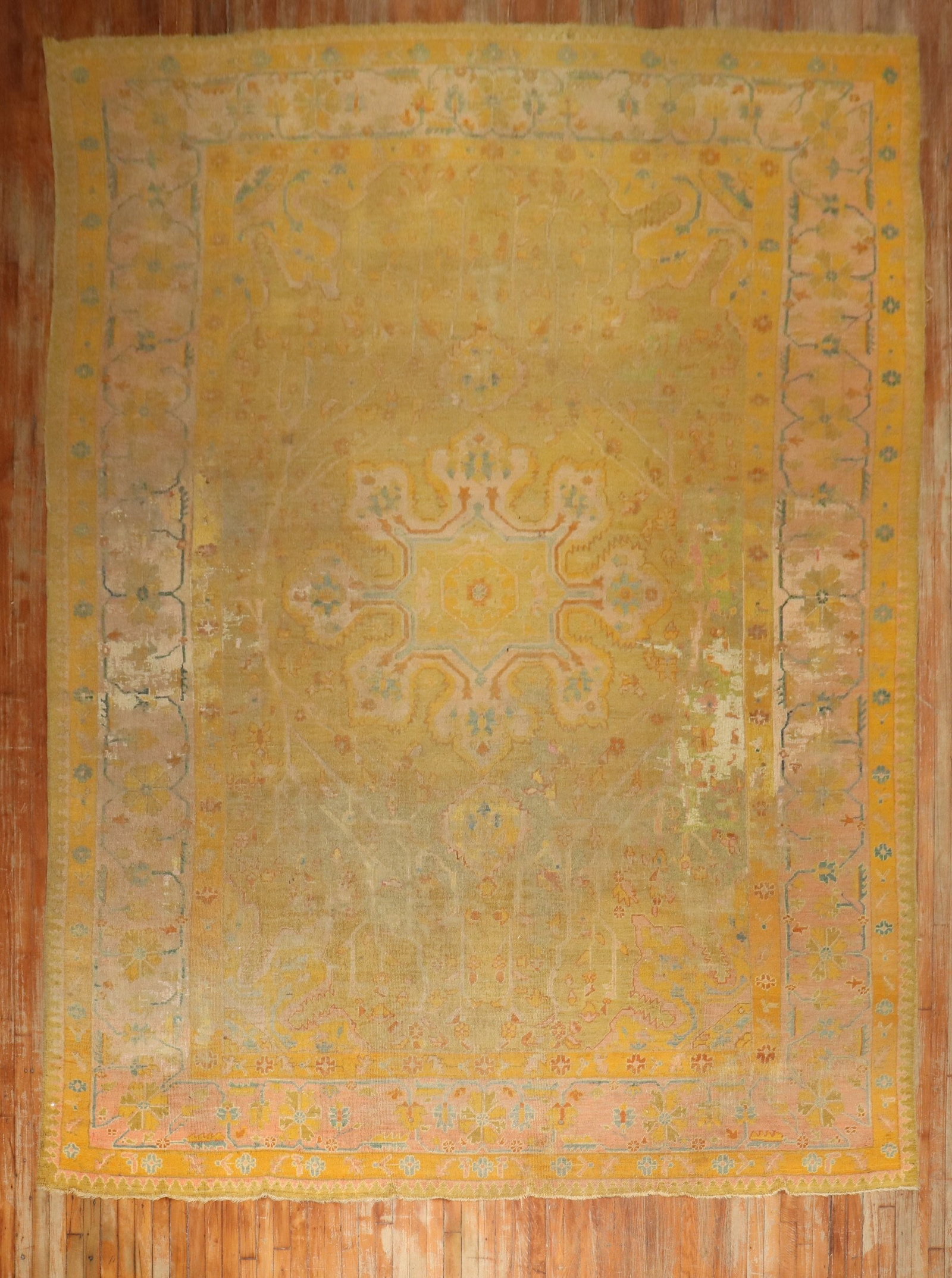 9' 9" x 15' Antique Turkish Oushak Rug Distressed Green Gold: 9' 9" x 15' Antique Turkish Oushak Rug Distressed Green Gold Late 19th century antique Turkish Oushak rug with a distressed finish and a green and gold palette. This pre-owned room-size rug is describ