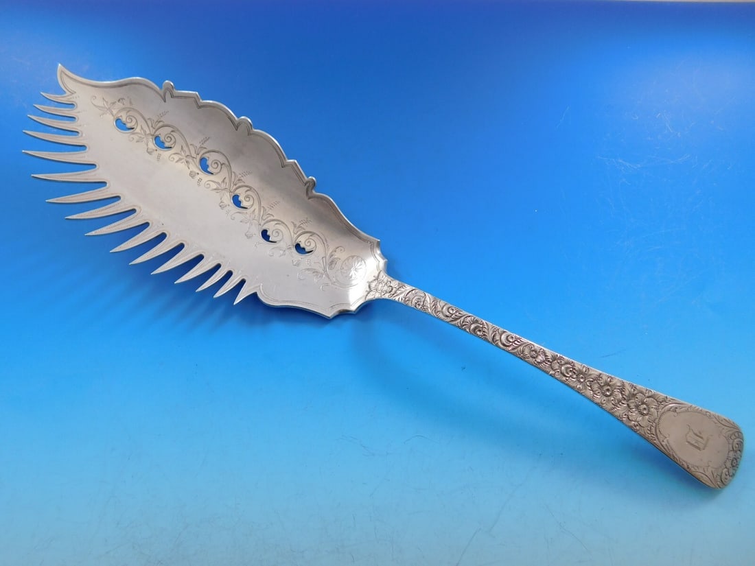 Bailey & Co. Antique Chased Sterling Silver Macaroni Server 11 3/4 in: Bailey & Co. Antique Chased Sterling Silver Macaroni Server 11 3/4 in This exquisite Antique Chased Macaroni Server by Bailey & Co. is crafted from high-quality sterling silver. Featuring a beautifull