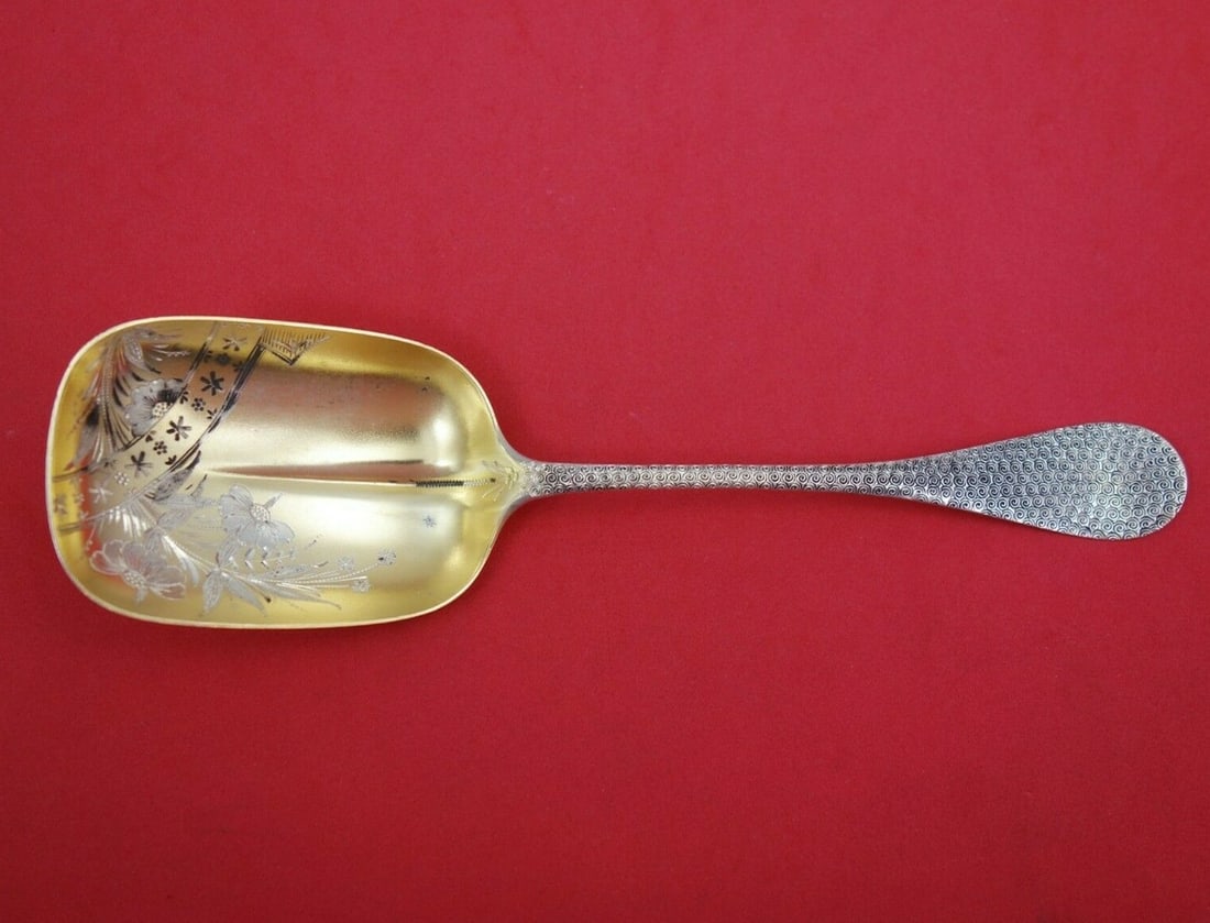 Wood & Hughes Sterling Silver Preserve Spoon Gold Wash Flowers 7.5": Wood & Hughes Sterling Silver Preserve Spoon Gold Wash Flowers 7.5" This exquisite Wood and Hughes preserve spoon features a stunning gold wash finish and intricate bright-cut flowers adorning the bow