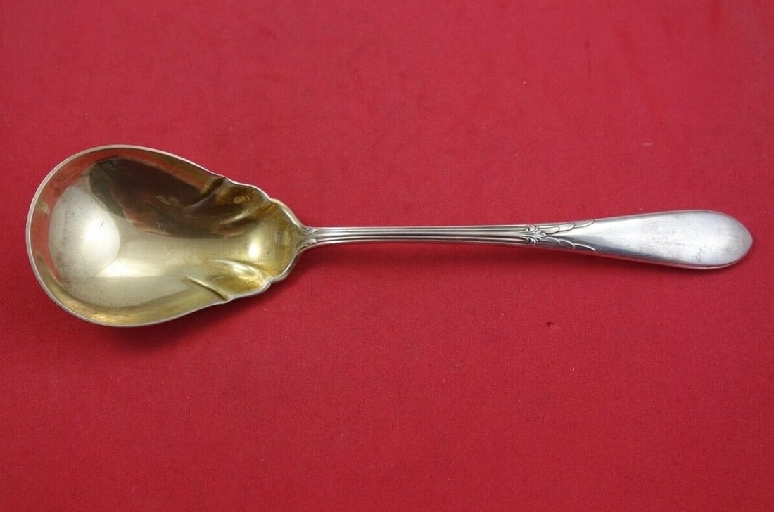 Gorham Rose Marie Sterling Silver Preserve Spoon Gold Washed 7 3/4": Gorham Rose Marie Sterling Silver Preserve Spoon Gold Washed 7 3/4" This exquisite Rose Marie Preserve Spoon by Gorham is crafted from high-quality sterling silver and features a beautiful gold wash. 