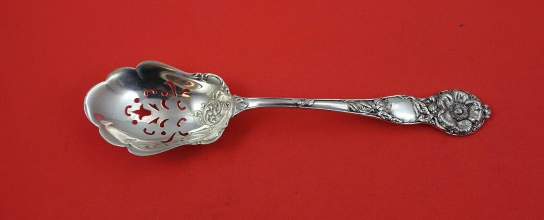 Watson Wild Rose Sterling Silver Pierced Ice Spoon 9 3/4": Watson Wild Rose Sterling Silver Pierced Ice Spoon 9 3/4" This exquisite serving spoon features the elegant Wild Rose pattern by Watson. Made of high-quality sterling silver, this ice spoon measures 9