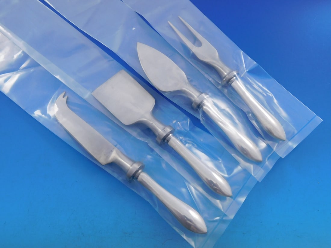 Dominick & Haff Pointed Antique Sterling Silver Cheese Set 4pc: Dominick & Haff Pointed Antique Sterling Silver Cheese Set 4pc Enhance your entertaining experience with this exquisite 4-piece cheese serving set from Dominick & Haff, featuring the elegant Pointed A