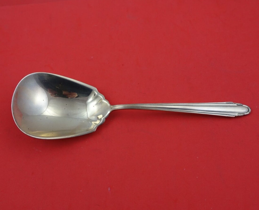 Dominick & Haff Contempora Sterling Silver Berry Spoon 9.25 Inch Serving: Dominick & Haff Contempora Sterling Silver Berry Spoon 9.25 Inch Serving This exquisite serving spoon is a stunning example of the Contempora pattern by Dominick & Haff, crafted from high-quality ster