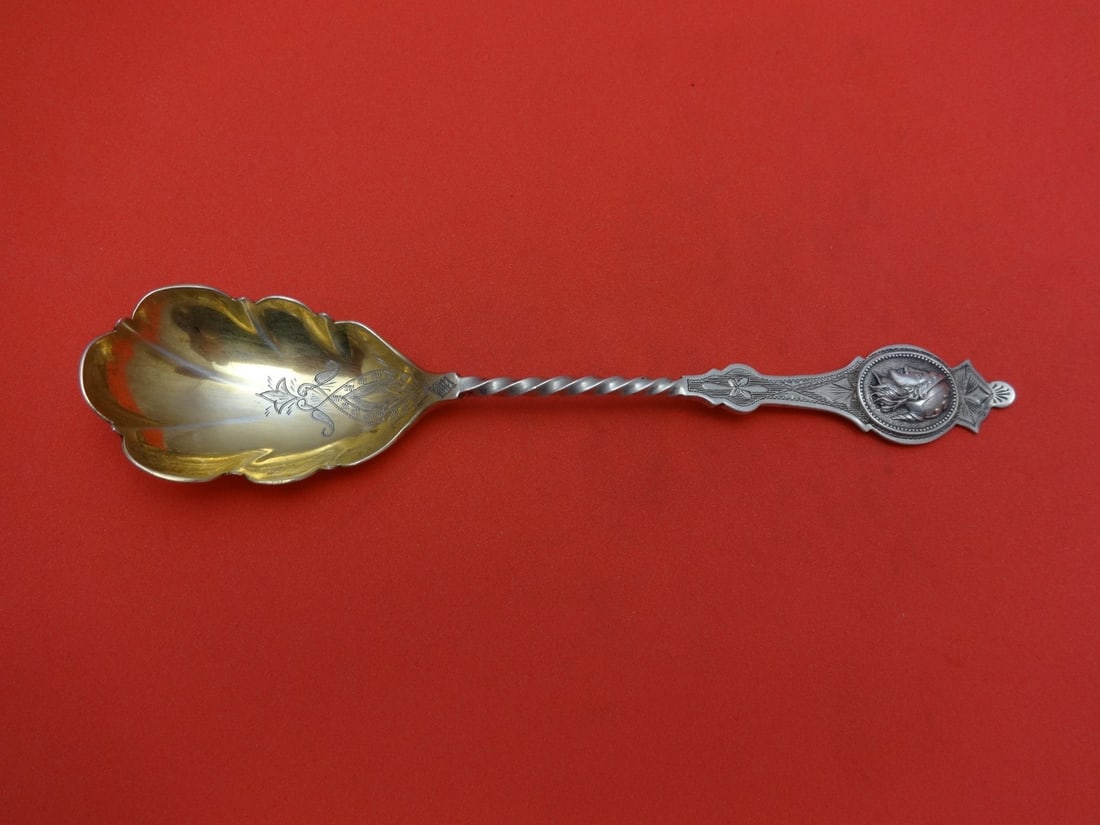 Gold Washed Coin Silver Preserve Spoon Twisted Rose Design 6 7/8": Gold Washed Coin Silver Preserve Spoon Twisted Rose Design 6 7/8" This beautiful preserve spoon features a stunning gold-washed finish and is crafted from coin silver. The twisted design is elegantly 