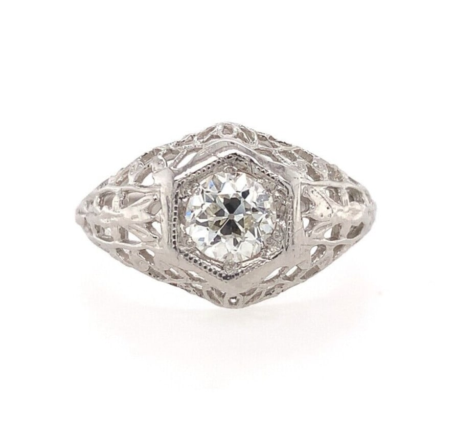 Art Deco 14k White Gold Filigree Ring with 1/2ct Diamond VS2: Art Deco 14k White Gold Filigree Ring with 1/2ct Diamond VS2 This exquisite Art Deco ring is crafted from 14k white gold and features a stunning European cut diamond weighing approximately 1/2 carat. 