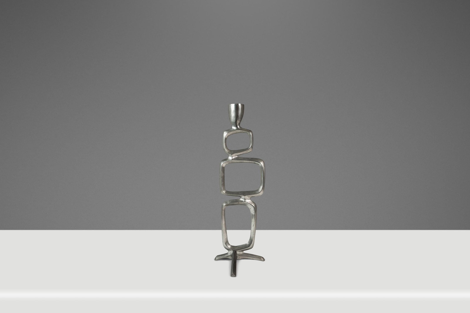 Brutalist Solid Aluminum Sculptural Candlestick Holder Attributed to Matthew Hilton 1980s: Brutalist Solid Aluminum Sculptural Candlestick Holder Attributed to Matthew Hilton 1980s This Mid-Century Modern Brutalist candlestick holder is crafted from solid aluminum and attributed to Matthew 