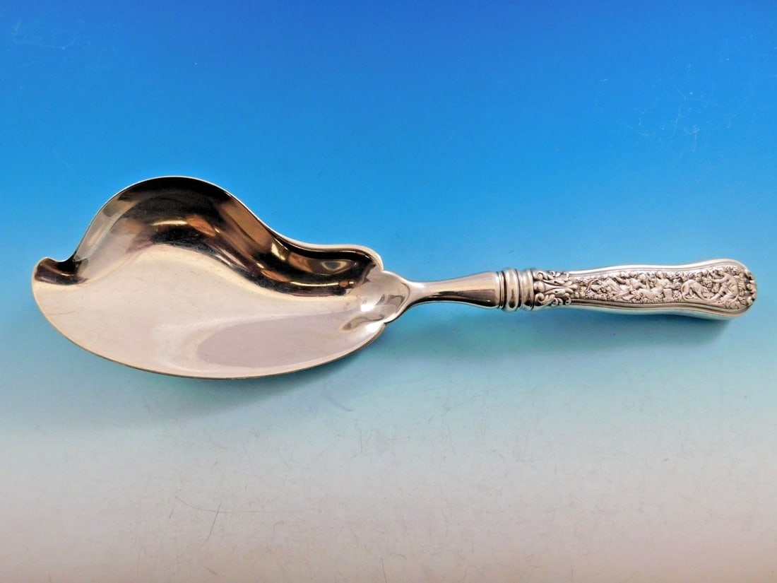 Tiffany & Co Olympian Sterling Silver Ice Cream Server 10 5/8 Rare: Tiffany & Co Olympian Sterling Silver Ice Cream Server 10 5/8 Rare Indulge in the elegance of the Olympian pattern ice cream server by Tiffany & Co., crafted from exquisite sterling silver. Measuring 