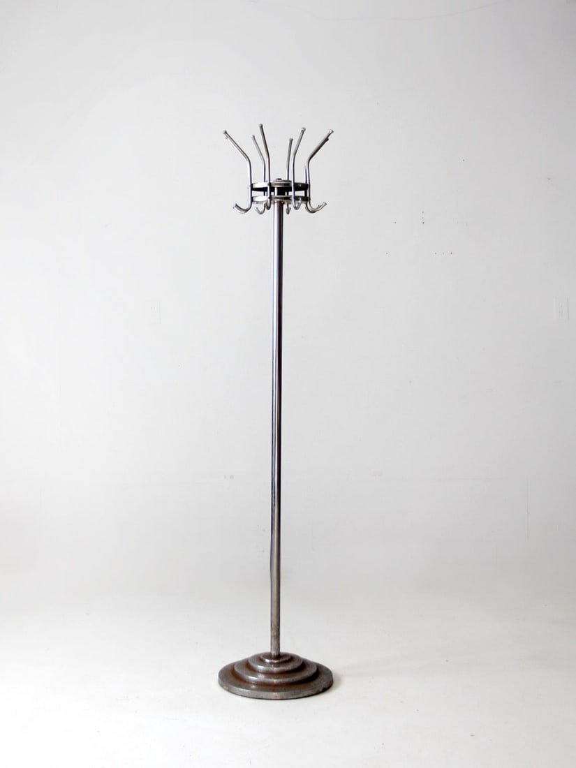 Mid-Century Chrome Standing Coat Rack with 8 Hooks: Mid-Century Chrome Standing Coat Rack with 8 Hooks This mid-century standing coat rack showcases a unique vintage industrial design. Crafted from chrome metal, it features eight hooks that can rotate 