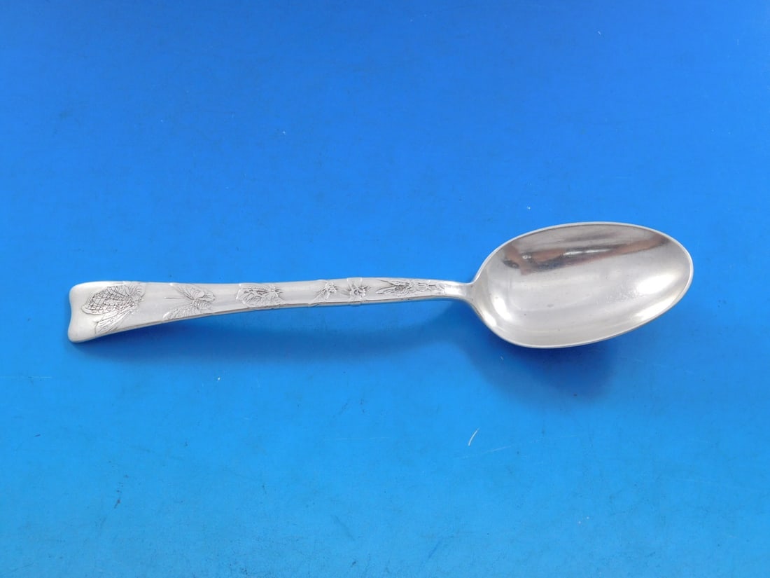Tiffany & Co. Lap Over Edge Sterling Silver Teaspoon 6" with Butterflies: Tiffany & Co. Lap Over Edge Sterling Silver Teaspoon 6" with Butterflies This exquisite teaspoon from Tiffany & Co. features the elegant Lap Over Edge pattern, acid etched with delicate butterfly desi