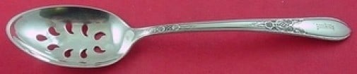 International Sterling Silver Cameo 9-Hole Slotted Serving Spoon 8 1/4": International Sterling Silver Cameo 9-Hole Slotted Serving Spoon 8 1/4" This exquisite slotted serving spoon is part of the Cameo pattern by International Sterling. Crafted from high-quality sterling 