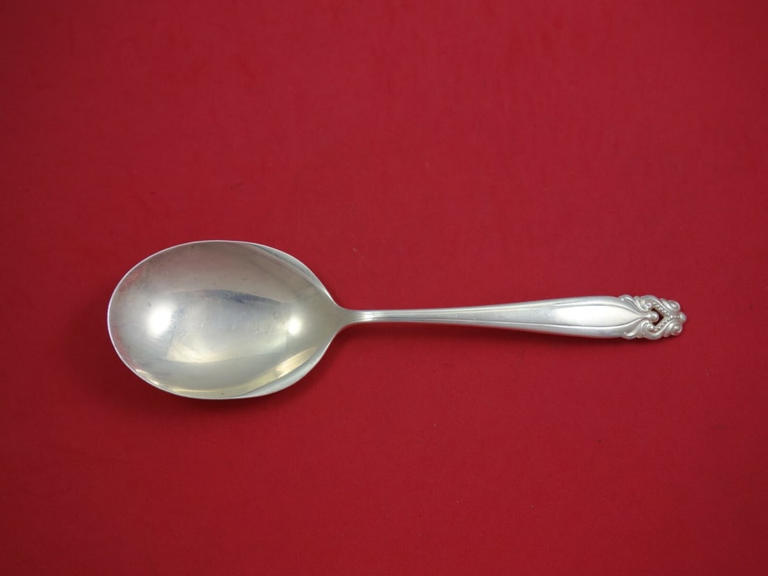 Wallace King Christian Sterling Silver Berry Spoon 9 1/8": Wallace King Christian Sterling Silver Berry Spoon 9 1/8" This exquisite berry spoon is crafted from sterling silver and features the elegant King Christian pattern by Wallace. Measuring 9 1/8", it sh