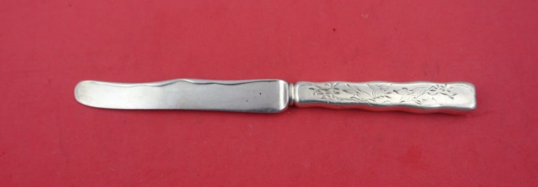 Tiffany & Co. Lap Over Edge Hand Engraved Sterling Silver Dessert Knife 7.25": Tiffany & Co. Lap Over Edge Hand Engraved Sterling Silver Dessert Knife 7.25" This exquisite dessert knife is crafted from sterling silver by Tiffany & Co. It features the elegant Lap Over Edge Hand E