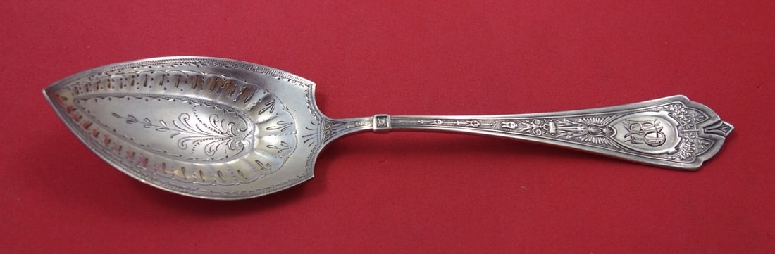 Schulz and Fischer Cleopatra Sterling Silver Serving Spoon Fluted 7 1/4: Schulz and Fischer Cleopatra Sterling Silver Serving Spoon Fluted 7 1/4 Sterling silver jelly spoon in the Cleopatra pattern by Schulz & Fischer. This serving spoon features a pointed, bright-cut, flu