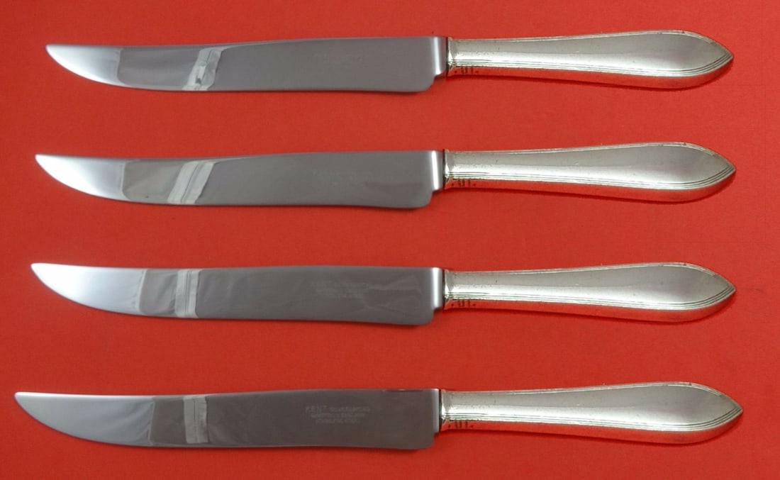 Tiffany & Co Reeded Edge Sterling Silver Steak Knife Set 4-Piece Texas Size: Tiffany & Co Reeded Edge Sterling Silver Steak Knife Set 4-Piece Texas Size This exquisite 4-piece steak knife set is crafted by Tiffany & Co. in the classic Reeded Edge pattern. Each knife features a