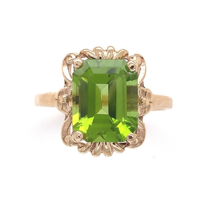 10k Yellow Gold Vintage 3.73 Carat Emerald Cut Peridot Ring Size 6.75 GIA Certified: 10k Yellow Gold Vintage 3.73 Carat Emerald Cut Peridot Ring Size 6.75 GIA Certified This exquisite ring showcases a vibrant emerald cut peridot, weighing 3.73 carats, set in luxurious 10k yellow gold.