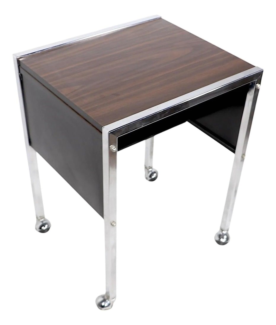 Mid Century Chrome Rolling Office Cart by Buddy Products 1970s: Mid Century Chrome Rolling Office Cart by Buddy Products 1970s This stylish Mid Century Office Cart from the 1970s is perfect for adding a touch of chic functionality to any space. Featuring a faux wo