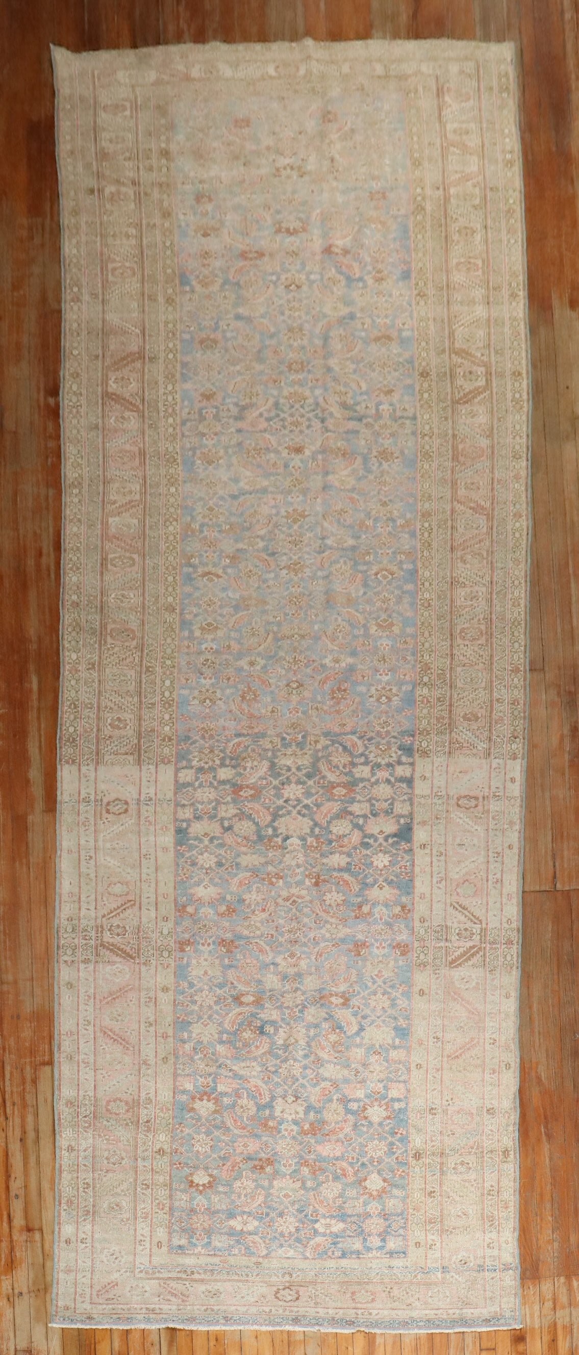 5' 9" x 17' 8" Persian Heriz corridor rug light blue pink: 5' 9" x 17' 8" Persian Heriz corridor rug light blue pink Early 20th century Persian Heriz corridor rug featuring a Herati design in light blue and pink. This pre-owned gallery-format rug is identifie