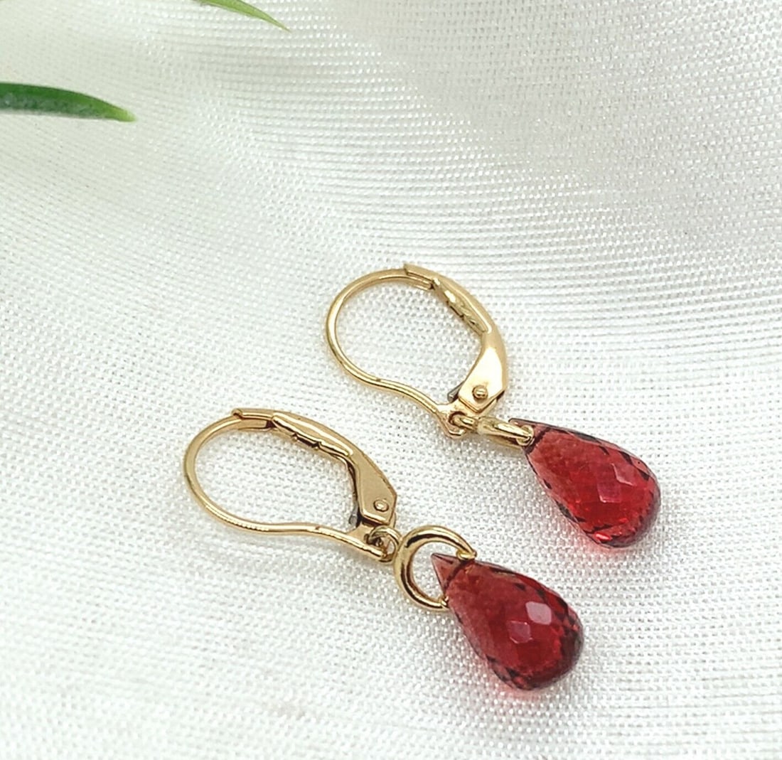 14k Yellow Gold 4.43 Carat Garnet Briolette Drop Earrings: 14k Yellow Gold 4.43 Carat Garnet Briolette Drop Earrings Enhance your jewelry collection with these stunning 14k Yellow Gold Genuine Natural Garnet Briolette Drop Earrings. Featuring a total carat we