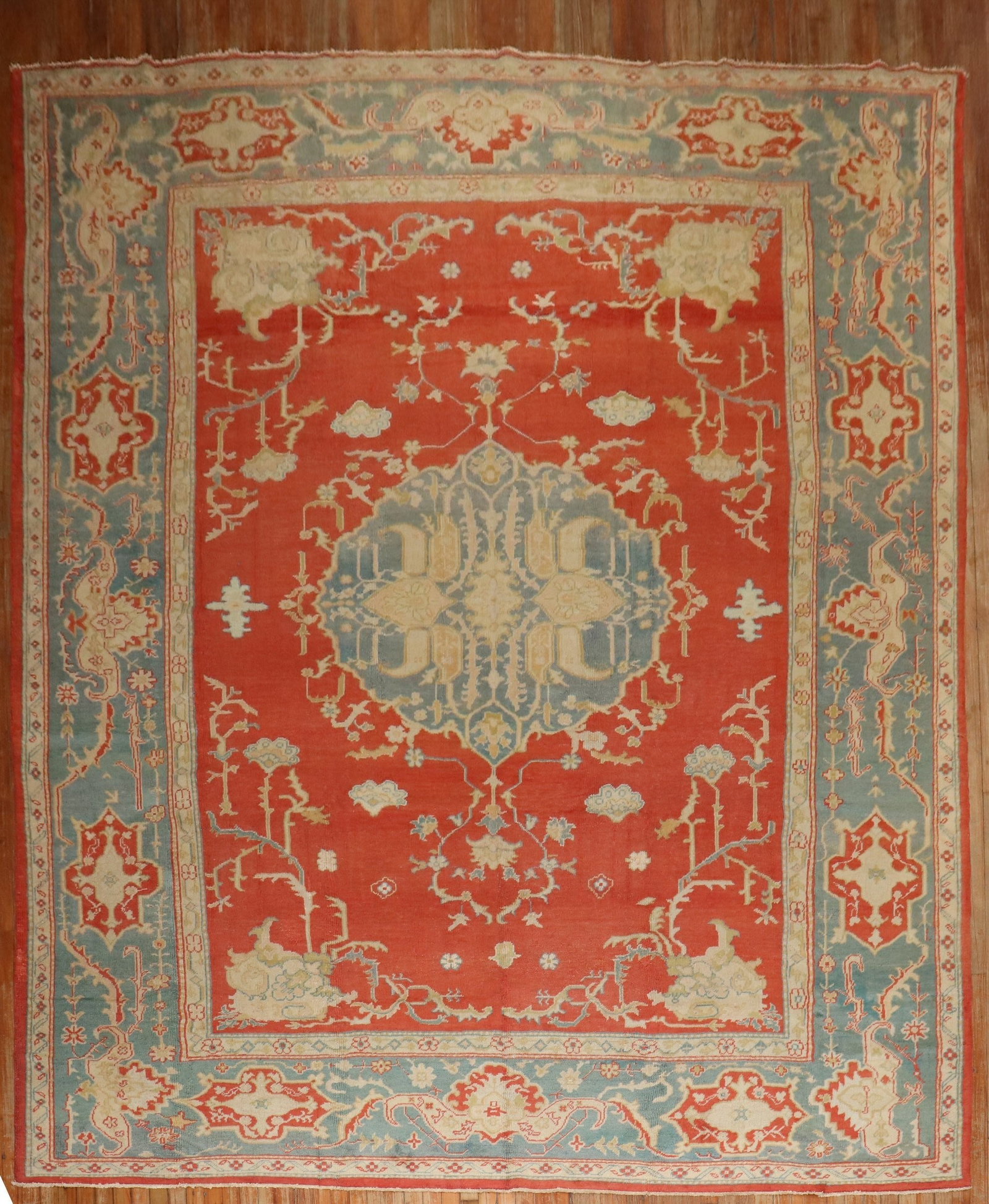9' 11" x 13' 5" Antique Oushak Room Rug Turkish: 9' 11" x 13' 5" Antique Oushak Room Rug Turkish Early 20th century antique Turkish Oushak rug with a room-size format. The rug features a decorative pattern in red with blue and cream accents. Pre-own