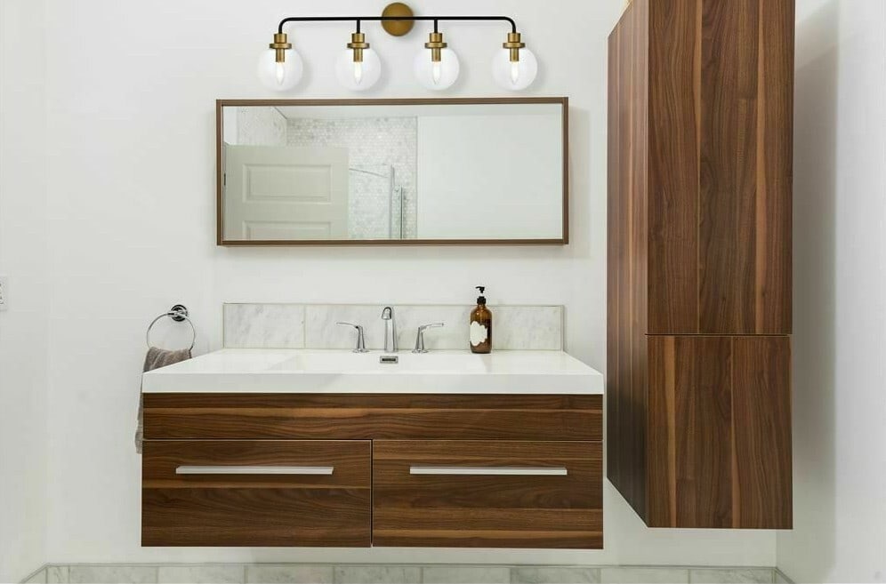 Hanson 4 Light Wall Sconce Black Brass Clear Glass 37.2 in: Hanson 4 Light Wall Sconce Black Brass Clear Glass 37.2 in Modern 4-light wall sconce in a black and brass finish with clear glass shades. It is hardwired, dimmable, and rated ETL dry for indoor use. 