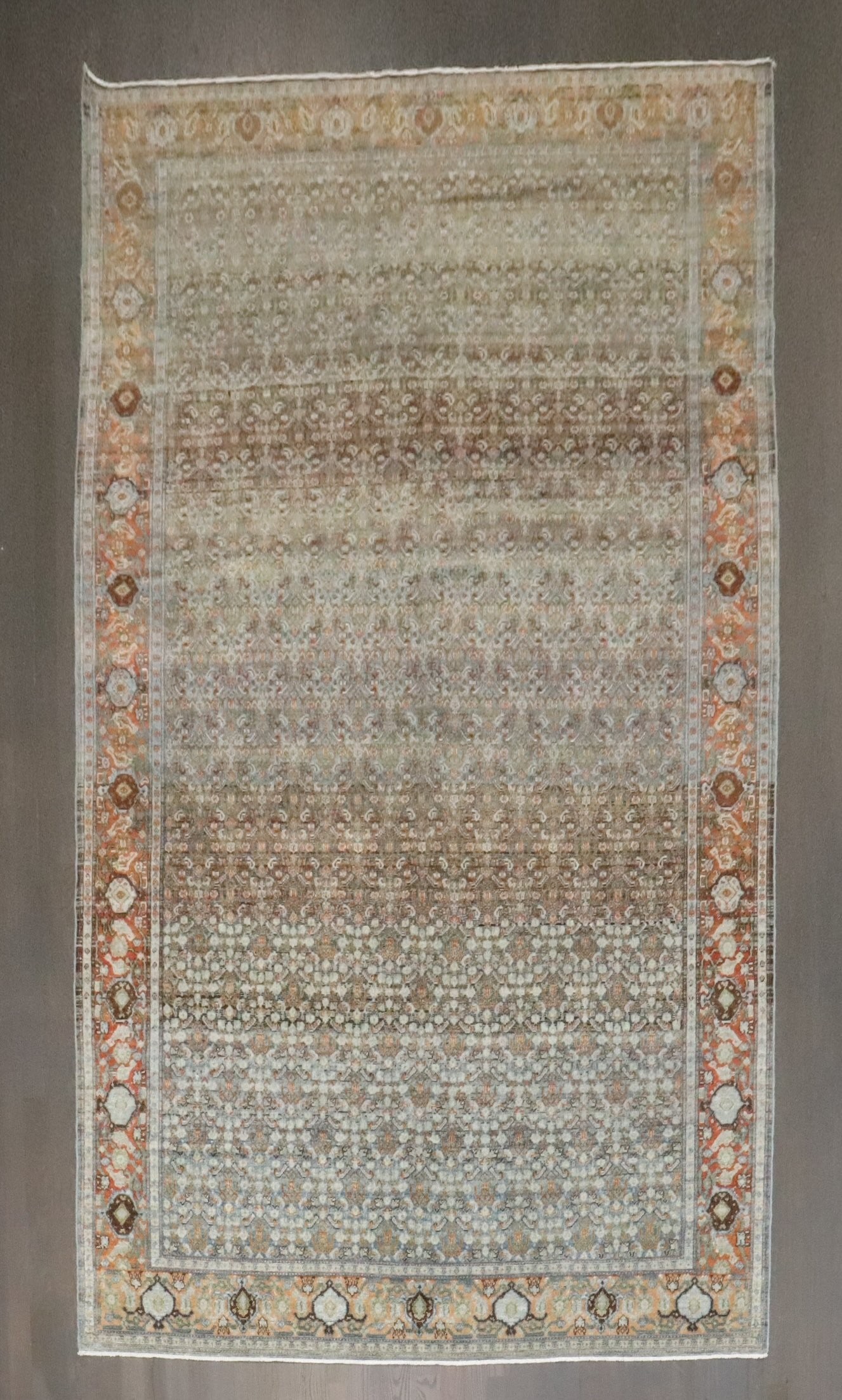 5' 8" x 10' 6" Persian Senneh Gallery Rug Early 20th Century: 5' 8" x 10' 6" Persian Senneh Gallery Rug Early 20th Century Early 20th century Persian Senneh gallery rug with an intricate floral pattern and detailed border. This pre-owned rug is identified as a S