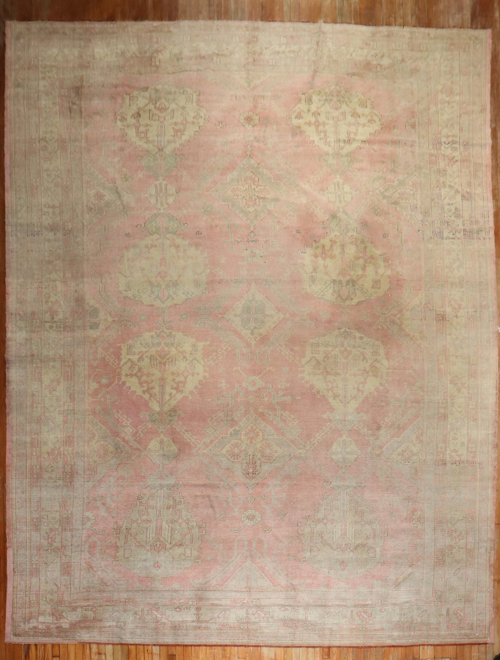 12' 2" x 17' 6" Oversize Turkish Oushak Rug in Pink: 12' 2" x 17' 6" Oversize Turkish Oushak Rug in Pink Early 20th century Turkish Oushak rug in a predominantly pink palette. This oversize antique rug features the classic Oushak style and presents as a