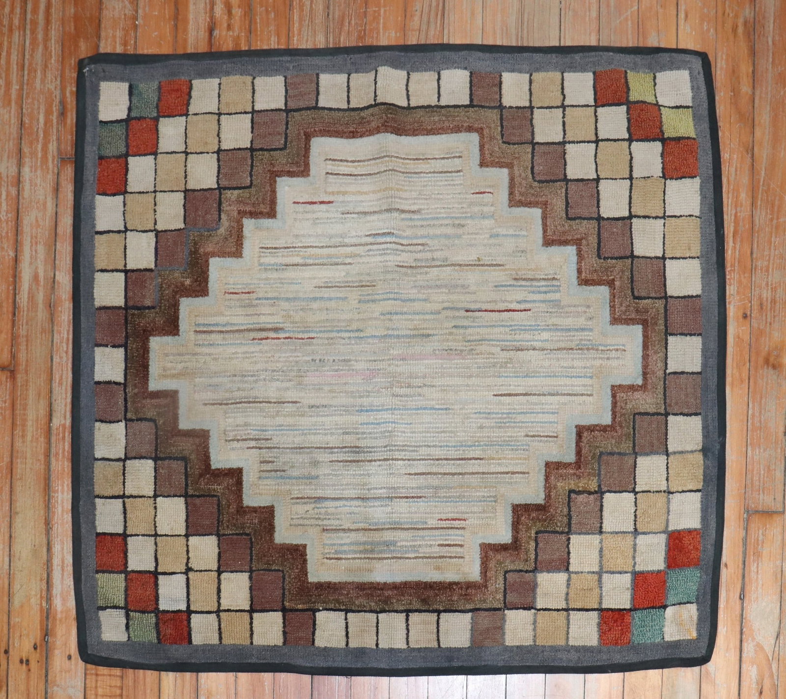 2' 10" x 3' 2" Early American hooked rug geometric design: 2' 10" x 3' 2" Early American hooked rug geometric design Early American hooked rug featuring a sought-after geometric design with a timeless look. This pre-owned rug is categorized as a small square 
