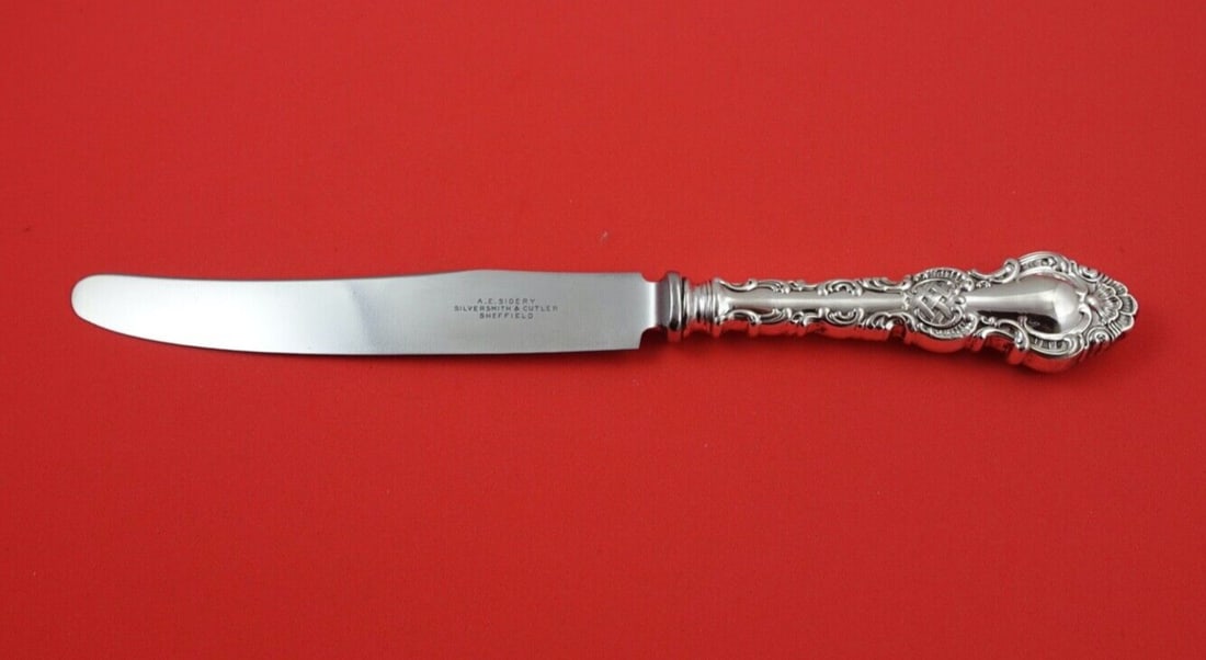 Durgin Regent Sterling Silver Dinner Knife French Blade 10 Inch: Durgin Regent Sterling Silver Dinner Knife French Blade 10 Inch This exquisite dinner knife features the Regent pattern by Durgin, crafted from high-quality sterling silver. The knife showcases a Fren