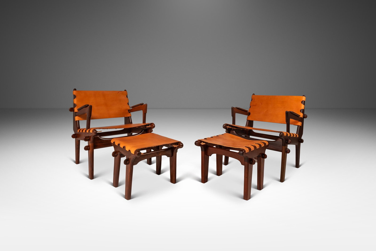 Angel Pazmino Set of 2 Mid-Century Modern Leather Sling Chairs with Ottomans: Angel Pazmino Set of 2 Mid-Century Modern Leather Sling Chairs with Ottomans This stunning set of two Mid-Century Modern sling chairs with ottomans, designed by acclaimed Ecuadorian furniture maker An
