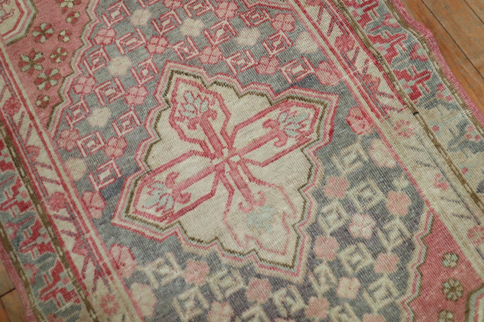 2' 3" x 10' 7" East Turkestan Khotan Rug Runner: 2' 3" x 10' 7" East Turkestan Khotan Rug Runner A pre-owned Khotan runner from East Turkestan in pink, dating to circa 1920. This narrow runner offers the distinctive character of a traditional Khotan