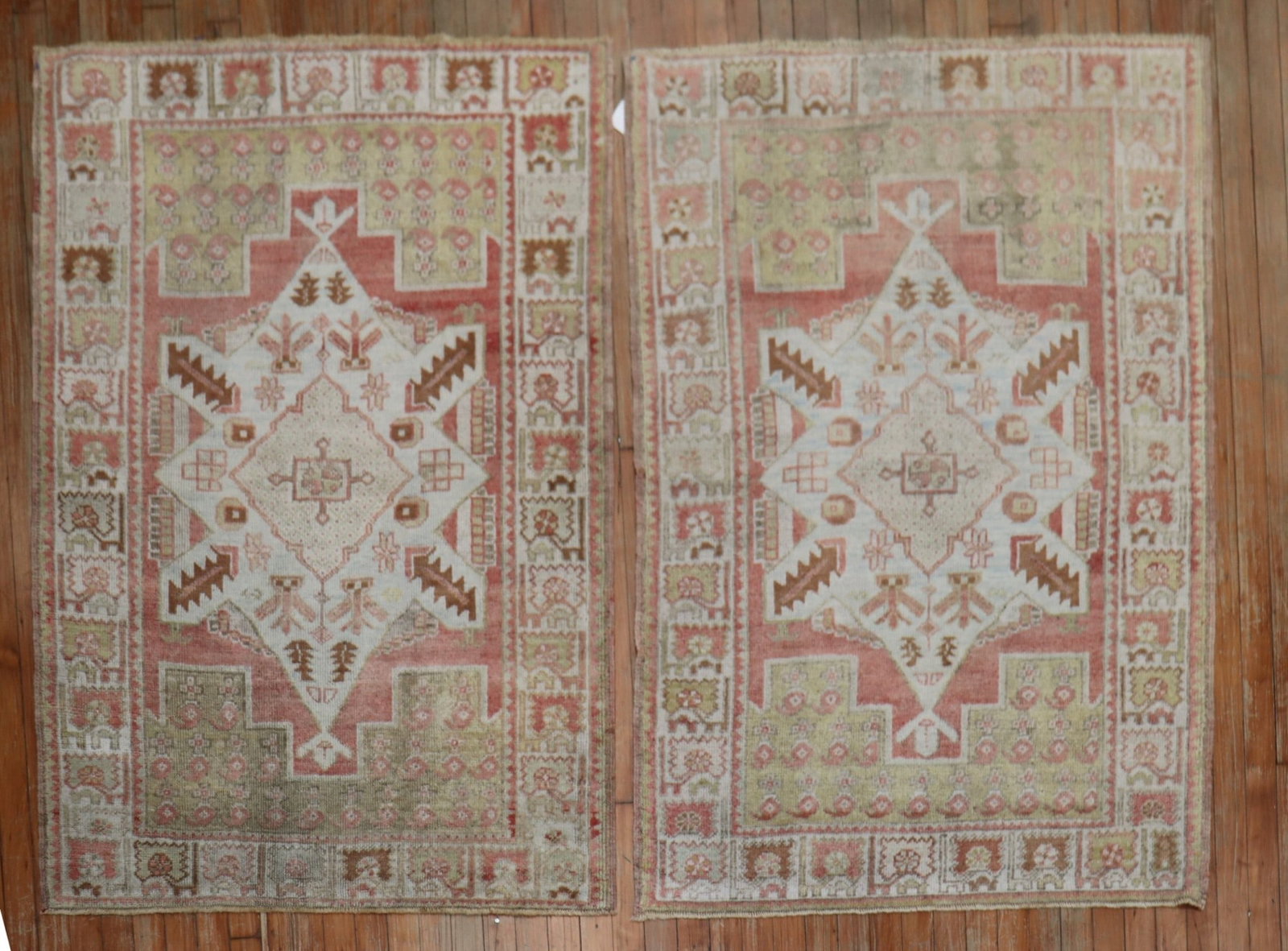 Pair of 1940s Turkish Oushak Rugs 3' 5" x 5': Pair of 1940s Turkish Oushak Rugs 3' 5" x 5' Rare matching pair of Turkish Oushak rugs from the 1940s, featuring a muted color palette. Offered as a pair, these small pre-owned rugs present a classic 