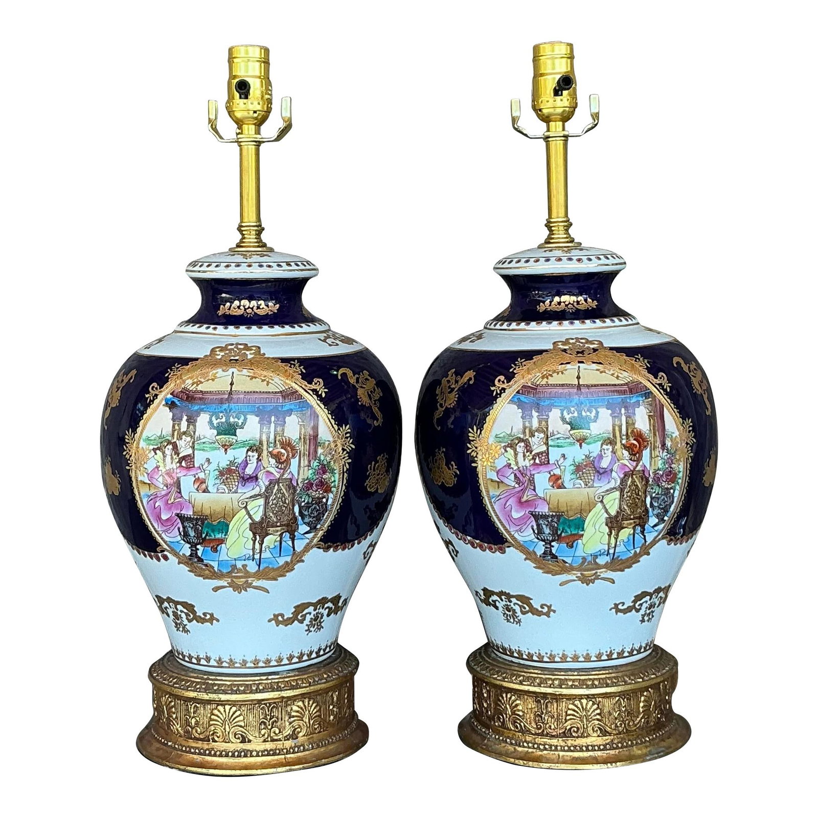 Elegant Vintage Limoges Lamps Pair with Gold Accents: Elegant Vintage Limoges Lamps Pair with Gold Accents This exquisite pair of vintage Limoges-style porcelain lamps showcases a stunning deep cobalt blue background embellished with lavish gold detailin