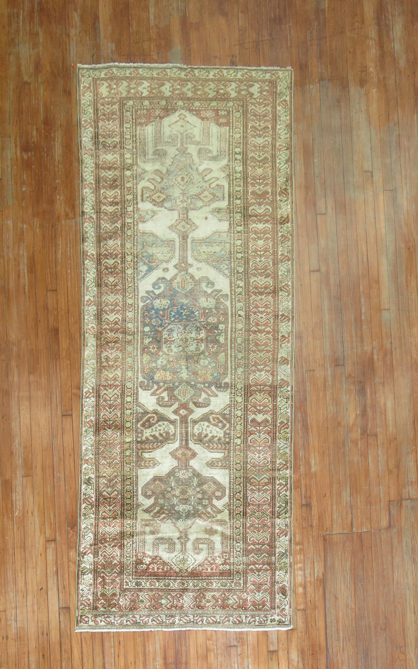 4' x 9' 10" Persian Malayer pictorial wide runner rug: 4' x 9' 10" Persian Malayer pictorial wide runner rug Early 20th century Persian Malayer wide runner with a pictorial field featuring some animals. Rendered in neutral tones, this pre-owned rug is cat