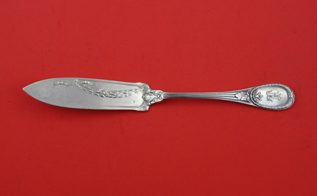 Christofle Trianon Silverplate Fish Knife 9in with Swags: Christofle Trianon Silverplate Fish Knife 9in with Swags Discover the elegance of the Trianon pattern by Christofle with this exquisite silverplate fish knife. Featuring a beautifully designed blade a