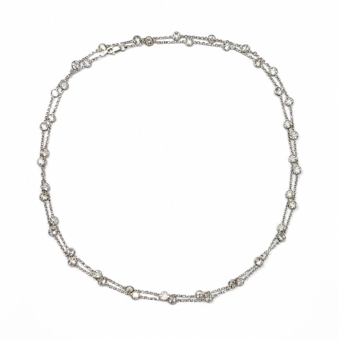 35 Inch Diamond By The Yard Necklace in Platinum and 14K White Gold: 35 Inch Diamond By The Yard Necklace in Platinum and 14K White Gold Elegant Diamonds by the Yard necklace crafted in platinum and 14K white gold, featuring 46 diamonds with substantial total carat