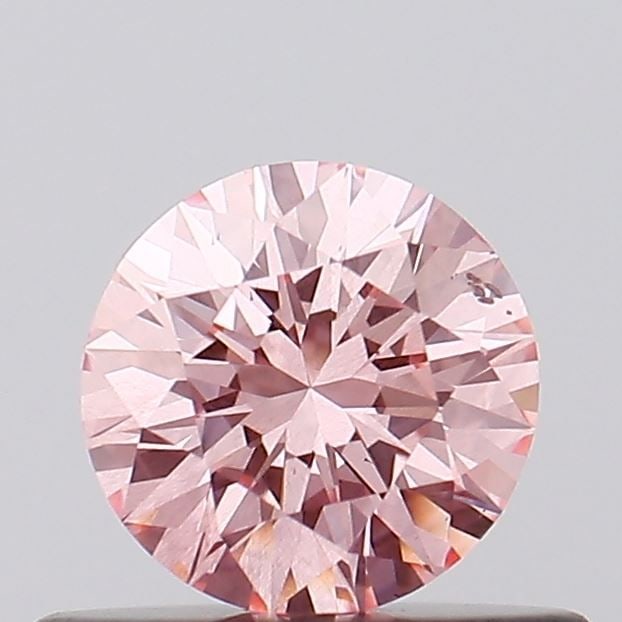 Loose Diamond - ROUND 0.43ct Fancy Vivid Pink SI2: Loose Diamond - ROUND 0.43ct Fancy Vivid Pink SI2 Source: This is a real non-mined Diamond that has been grown in a lab Shape: ROUND Carats: 0.43 Color: Fancy Vivid Pink Certification: IGI Video: