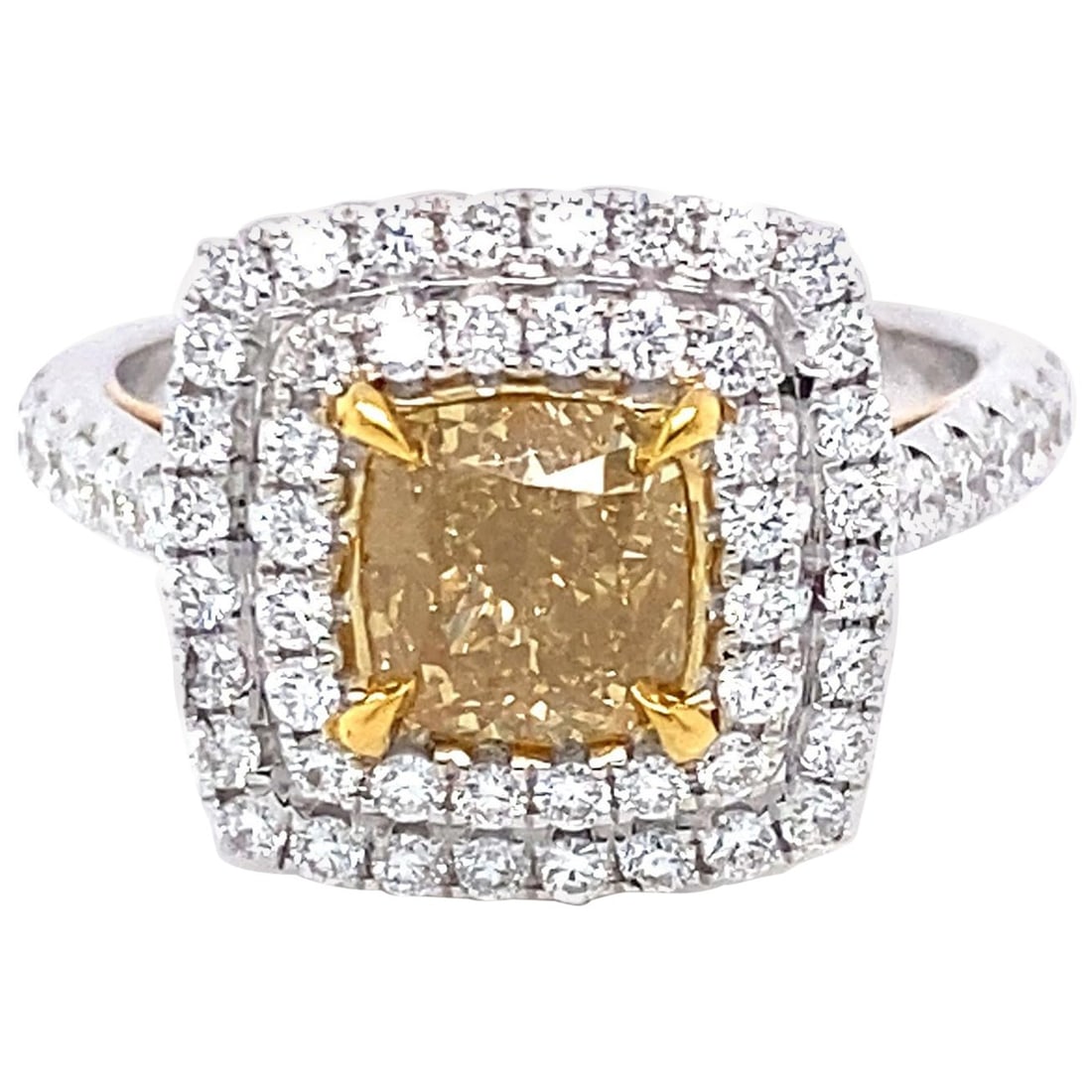 18k Fancy Yellow Cushion Diamond Halo Ring GIA 2.07ctt: 18k Fancy Yellow Cushion Diamond Halo Ring GIA 2.07ctt GIA certified contemporary halo ring featuring a cushion cut Fancy Brownish Yellow diamond surrounded by white diamonds in a two-tone 18k yellow 