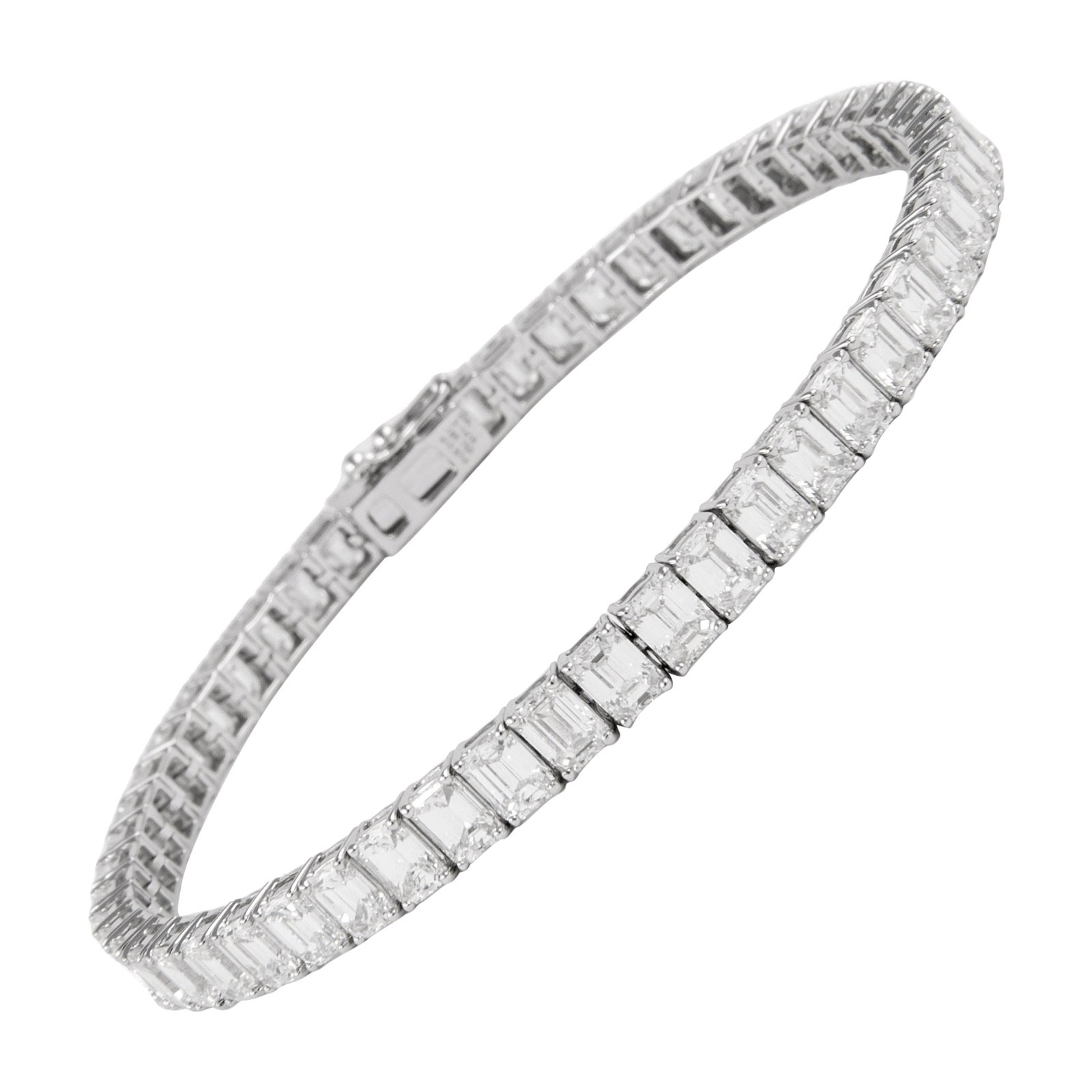 18k White Gold 12.67ct Emerald Cut Diamond Bracelet: 18k White Gold 12.67ct Emerald Cut Diamond Bracelet Modern natural diamond tennis bracelet set with 54 emerald cut diamonds totaling 12.67 ct, approximately F color and VS1 clarity, in 18k white gold.